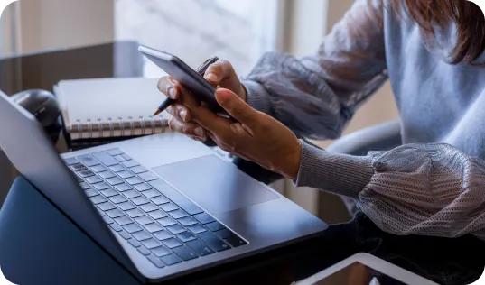 Hands interacting with a cellular phone